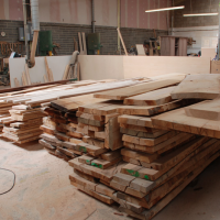 the furniture works stacks of lovely waney edge timber to work with